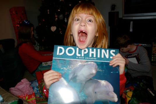 This girl is crazy about dolphins!