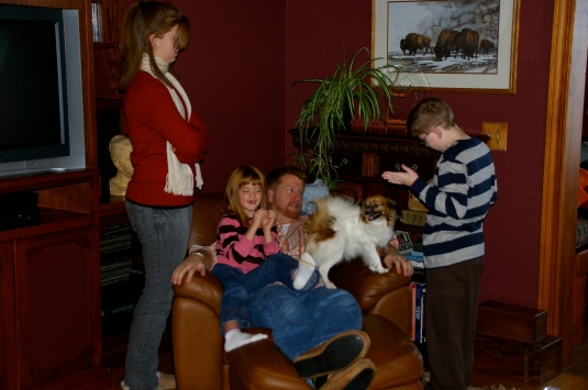 The kids congregate around Daddy and Dolly the dog